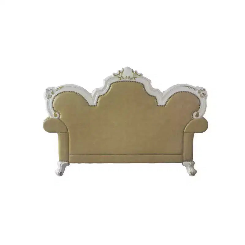 Causeuse capitonnée avec cadre sculpté et coussins décoratifs