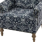 Fauteuil rembourré en bois avec motif floral, accoudoirs à panneaux et dossier en forme de bosse de chameau.